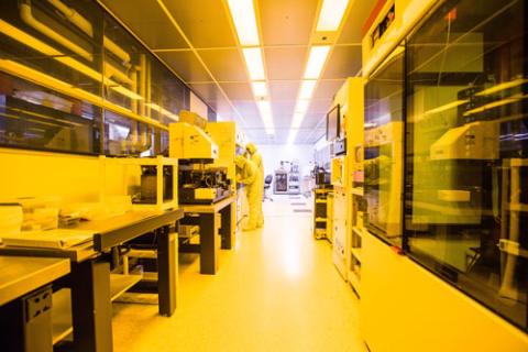 Two researchers working in the cleanroom